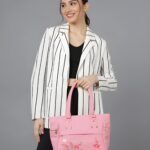 Women’s pink tote handbag with floral embroidery and multiple zipper pockets