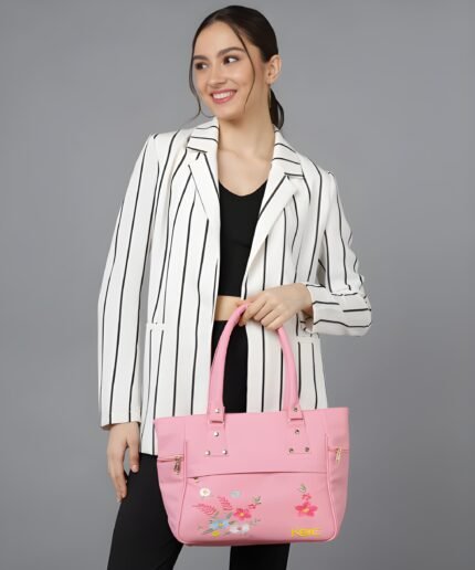Women’s pink tote handbag with floral embroidery and multiple zipper pockets
