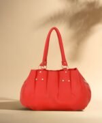 Women’s red tote handbag with spacious interior and zipper closure